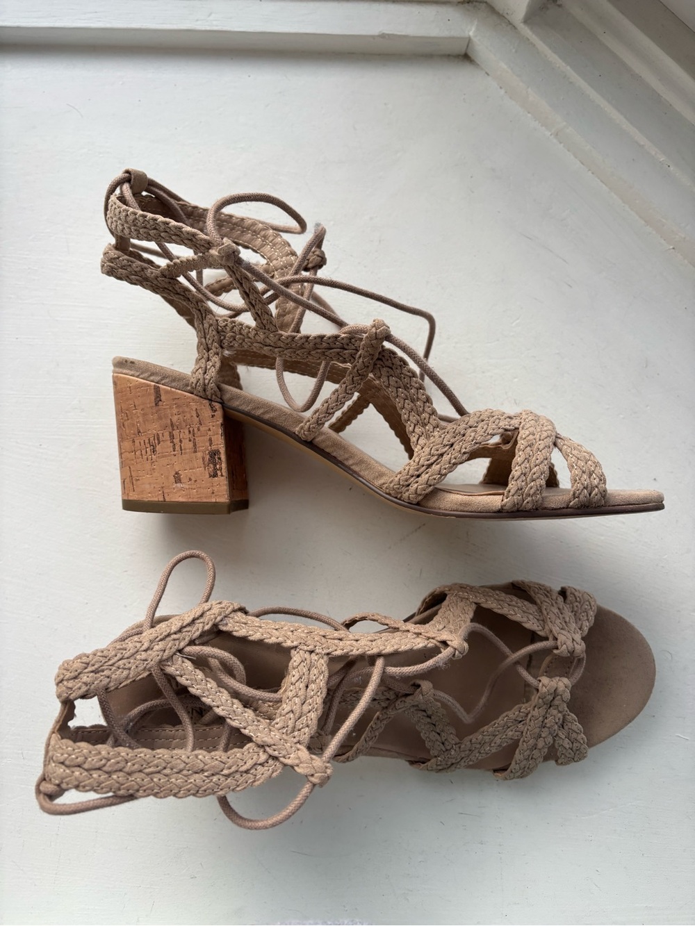 Cream color braided sandals with cork heel
Size 7.5